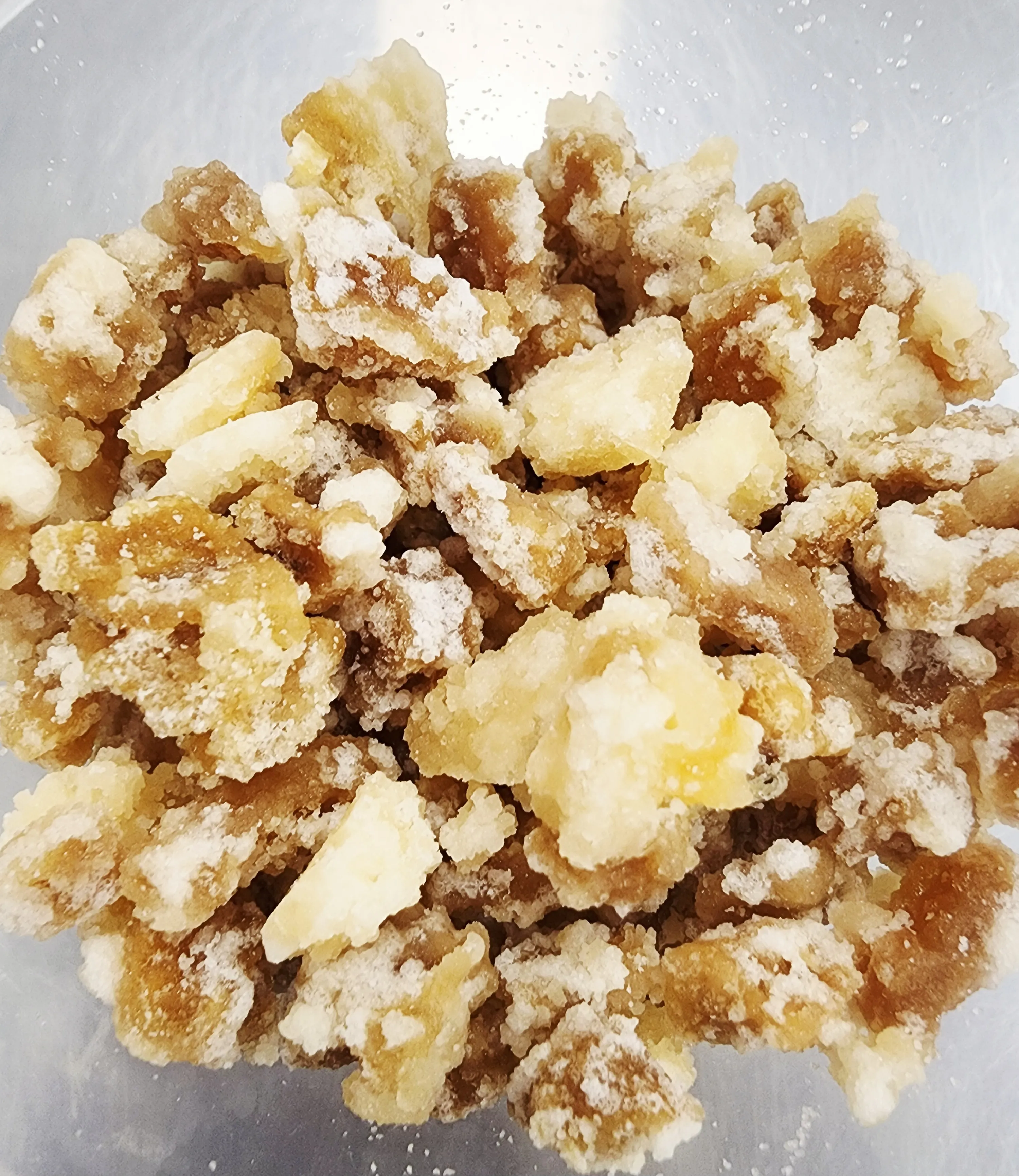 Hand-candied ginger pieces, sugar-crusted