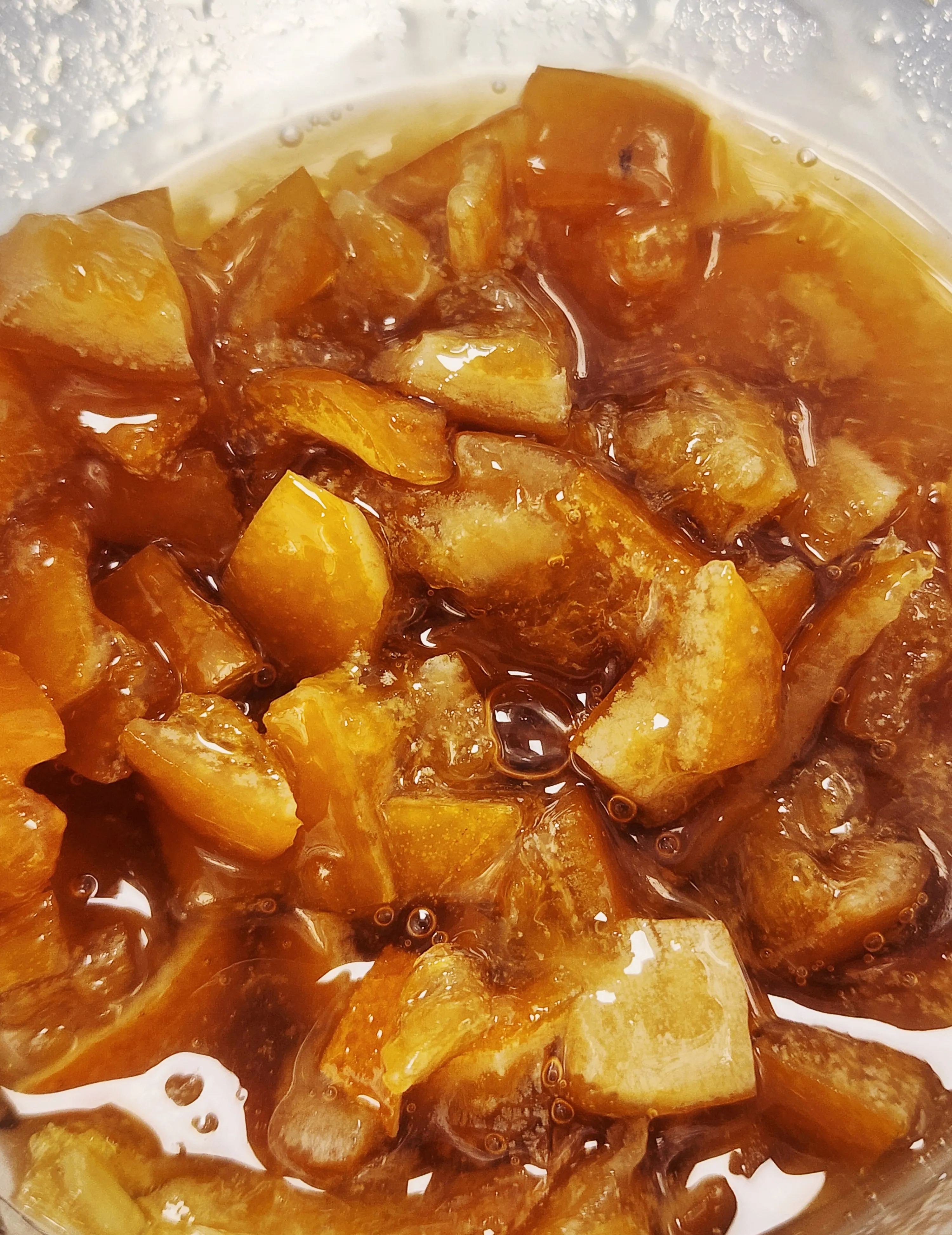 Hand-candied lemon pieces in glossy amber syrup